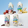 Four Maeil Dairies Selex protein drink cartons arranged with fruit, nuts and dessert ingredients.