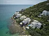 The white-roofed villas at Premier Village Phu Quoc. Nestled at the southern tip of the island, it is one of the few places in the world where guests can witness both the sunrise and sunset over the ocean from a single location. [SUN GROUP]