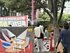 People smoke around an ashtray bin in Hongdae in Mapo District, western Seoul, on May 2. [SHIN MIN-HEE]