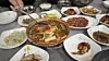 Galchi-jjim, or braised cutlassfish, and kkotgesal (crab meat) bibimbap served at Chown Restaurant in Mokpo [WOO JI-WON]