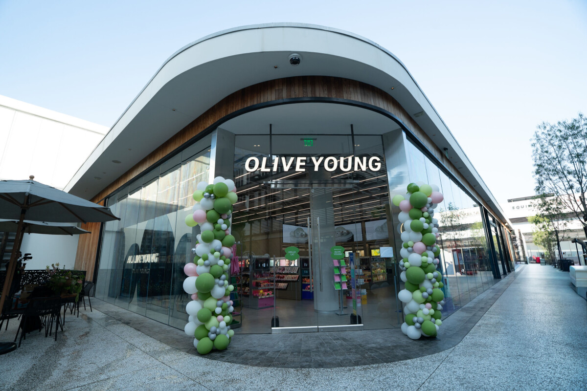 Olive Young Century City store exterior in Los Angeles with glass storefront and balloon arches ahead of K-beauty launch