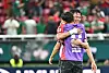 Son Heung-min, who is wearing a purple-colored vest, hugs Oh Hyeon-gyu after winning in a FIFA World Cup 2026 match in Guadalajara, Mexico, on June 11.