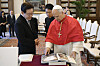 Pope Leo XIV explains about the catalog book of the papal audience halls to President Lee Jae Myung in Vatican on June 15.