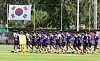 Korean national footballers run on a field during their training session in Mexico on June 15.