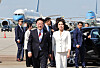 President Lee Jae Myung, left, and first lady Kim Hea Kyung arrive at an airport in Geneva, Switzerland, on June 17.