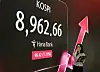 Kospi reaches 8,962.66 during an intraday trading session on May 18. The electronic display shows Kospi fluctuation in a bank in central Seoul.