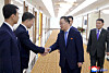 North Korean Vice Foreign Minister Kim Son-gyong, center, shakes hands with officials in a photo provided by the Korean Central News Agency.