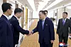 North Korean Vice Foreign Minister Kim Son-gyong, center, shakes hands with officials in a photo provided by the Korean Central News Agency.