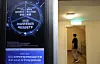 SpaceX-related ETF offering is advertised on an electronic board at an apartment complex in Seoul on June 14.