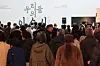 Crowd of visitors stands in front of the 'Our Yi Sun-sin' exhibition wall at the National Museum of Korea.