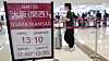 A notice of check-in hours for a flight bound for Kansai International Airport in Osaka is seen at Gimpo International Airport in western Seoul on June 23.