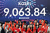 People celebrate Kospi's 9,000-threshold crossing at Woori Bank in central Seoul on June 18.