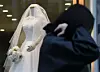 A pedestrian walks by a wedding dress shop in Ahyeon-dong, western Seoul, on March 19, 2024.