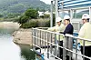 Environment Minister Kim Sung-whan, left, inspects dam operation at Seomjin River in North Jeolla on June 17.