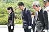 Japanese Defense Minister Shinjiro Koizumi, center, pays tribute at Seoul National Cemetery in Dongjak District in southern Seoul on June 27.