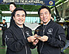 Korean Defense Minister Ahn Gyu-back and Japanese Defense Minister Shinjiro Koizumi holds an aircraft model at Black Eagles' base in Gangwon on June 27.
