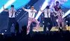 Psy performs onstage with dancers and a live band during a concert in Uijeongbu.