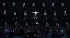 Psy performs on a dark concert stage with dancers and a cheering crowd below.