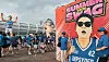 Fans pose for photos in front of a Psy Summer Swag 2026 concert display at Uijeongbu Stadium.