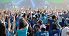 Festival crowd raises hands during Psy's Summer Swag 2026 concert at an outdoor venue.