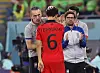 Korea's head coach Paulo Bento, left, comforts Hwang In-beom, center, during the FIFA World Cup 2022 round of 16 soccer match between Brazil and Korea in Doha, Qatar, in 2022.