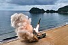 A projectile is seen launched in an undated photo provided by the Rodong Sinmun.
