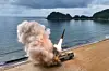 A projectile is seen launched in an undated photo provided by the Rodong Sinmun.