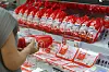A consumer buys a processed chicken at a supermarket in Seoul on June 24.