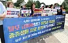 Officials from patients' groups object extending state health insurance coverage to treat hair loss during a press conference held in central Seoul on June 29.