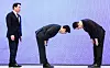 President Lee Jae Myung, center, and Samsung Electronics Executive Chairman Lee Jae-yong bow each other after the company's massive investment in the southwest region at the Blue House in Jongno District, central Seoul, on June 29.