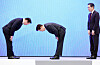 President Lee Jae Myung, center, and SK Group Chairman Chey Tae-won bow to each other after the company's massive investment in the southwest region at the Blue House in Jongno District, central Seoul, on June 29.