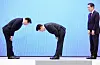 President Lee Jae Myung, center, and SK Group Chairman Chey Tae-won bow to each other after the company's massive investment in the southwest region at the Blue House in Jongno District, central Seoul, on June 29.