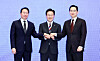 From left, SK Group Chairman Chey Tae-won, President Lee Jae Myung, and Samsung Electronics Executive Chairman Lee Jae-yong join hands after $520 billion investments for four new chip plants at the Blue House in Jongno District, central Seoul, on June 29.
