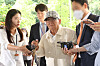 Shincheonji leader Lee Man-hee, center, enters the Seoul Central District Court in southern Seoul on June 24.