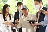 Shincheonji leader Lee Man-hee, center, enters the Seoul Central District Court in southern Seoul on June 24.