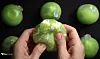 A person smashes a wakkpu ball in a YouTube video with at least five more wakkpu balls in wait to be crashed in background.