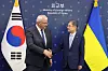 Korean Foreign Minister Cho Hyun, right, shakes hands with Ukrainian Foreign Minister Andrii Sybiha in central Seoul on June 30.
