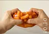 A wakppu ball filled with tteokbokki (spicy rice cakes) created by generative AI video tools is shown in a social media video uploaded on May 18.