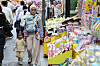 International visitors walk in a shopping district in Seoul on May 13.