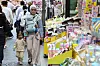 International visitors walk in a shopping district in Seoul on May 13.