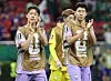 South Korea players Son Heung-min and Lee Jae-sung applaud after a 1-0 loss to Mexico.