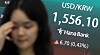 A dollar-won exchange rate at 1,556.1 is displayed at an electronic screen in Hana Bank's trading room in central Seoul on July 1.