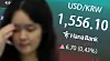 A dollar-won exchange rate at 1,556.1 is displayed at an electronic screen in Hana Bank's trading room in central Seoul on July 1.