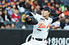 Hanwha Eagles pitcher Wang Yan-cheng winds up to throw during a baseball game.