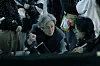 Choi Min-sik and director Kim Gyu-tae on a film set with crew and monitors.