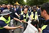 A protester is restrained after rushing toward lawmakers entering a vote-counting center in southern Seoul on July 2.