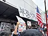 Protesters hold pickets claiming 'rigged election' in front of a vote-counting center in southern Seoul on July 2.