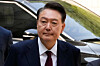 Former President Yoon Suk Yeol arrives to attend his trial at the Seoul Central District Court in southern Seoul, May 12, 2025.