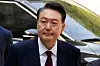 Former President Yoon Suk Yeol arrives to attend his trial at the Seoul Central District Court in southern Seoul, May 12, 2025.