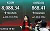 A screen in Hana Bank's trading room in central Seoul shows the Kospi closing at 8,088.34 points on July 3, up 440.25 points, or 5.76 percent, from the previous trading session.